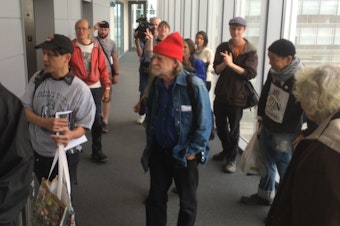 caption: Homeless advocates gather outside Seattle Mayor Ed Murray's office.