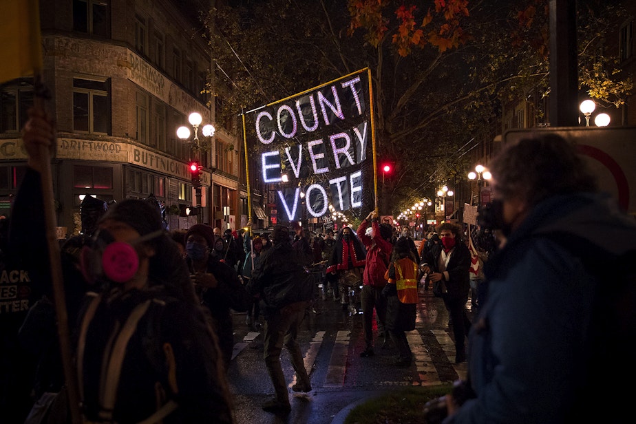 caption: Hundreds gathered to march through Pioneer Square on Wednesday, November 4, 2020, the day after the 2020 presidential election, in Seattle. The event focused on making sure every vote was counted and every person was protected. A coalition of groups who have been demonstrating for racial justice and against police brutality in Seattle every day for months asked participants to show up for Black lives every day, not only during the election. 