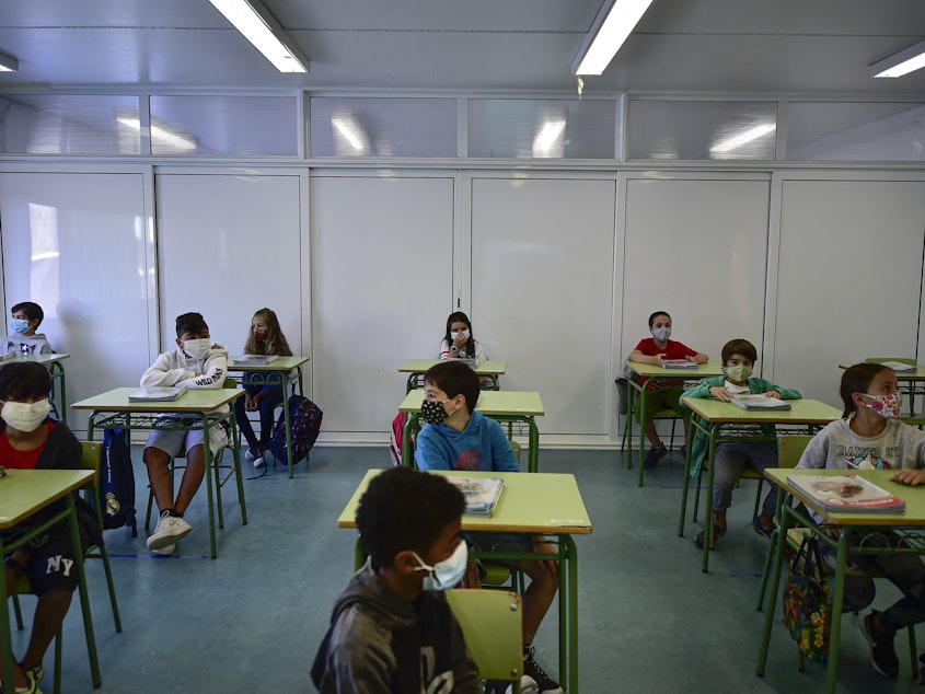 caption: Students attend the first day of school in the small town of Labastida, Spain, on Sept. 8. A recent study found no link between coronavirus spikes and school reopenings in the country.