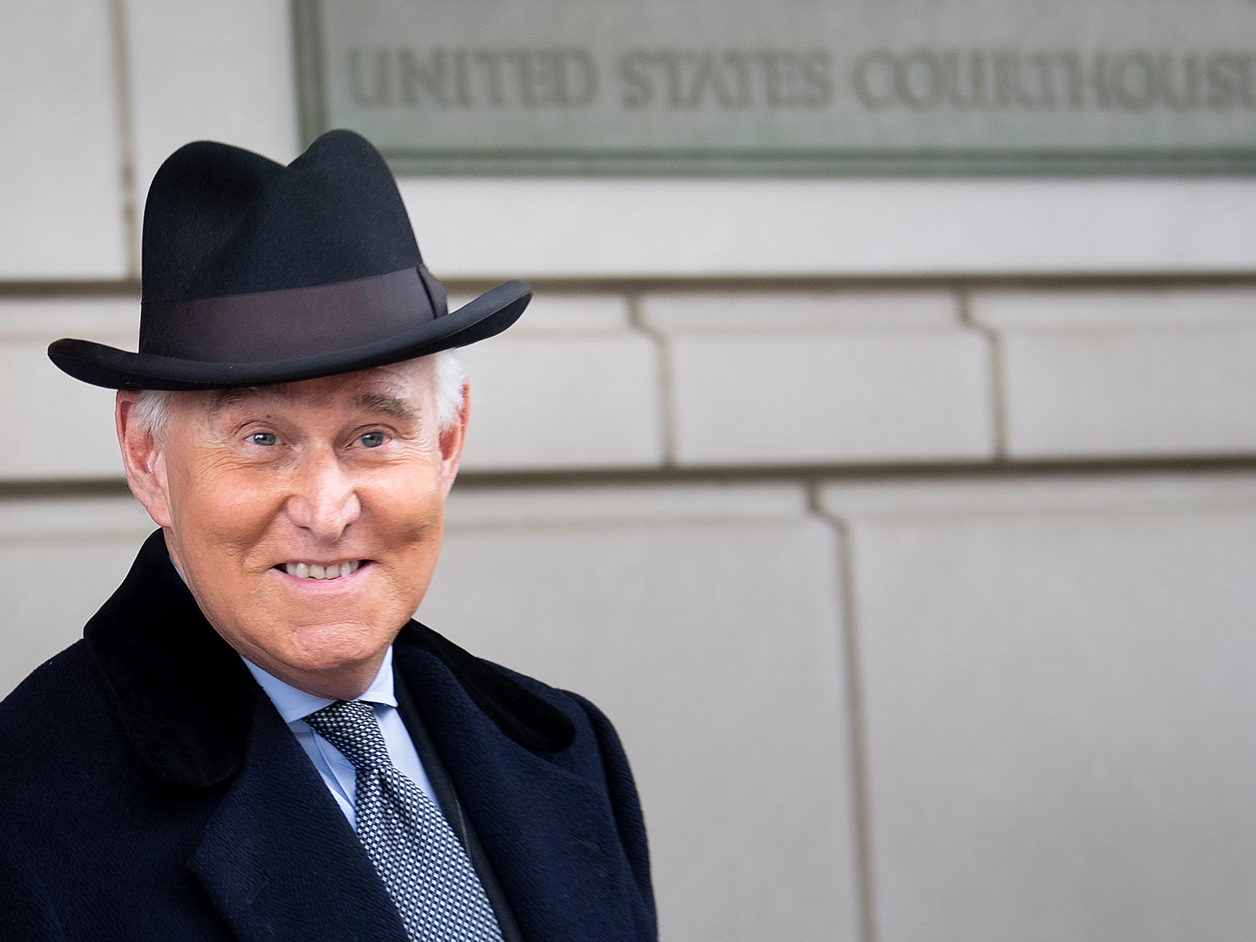 caption: Roger Stone leaves federal court after a sentencing hearing in February in Washington, D.C.