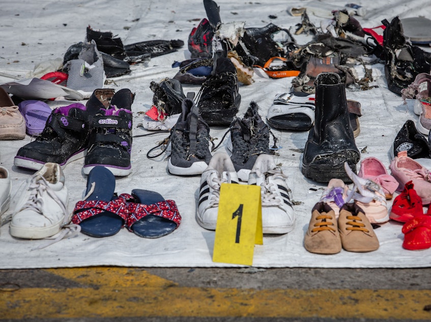caption: Personal items recovered from Lion Air flight JT610 by search-and-rescue personnel at the Tanjung Priok port on Wednesday in Jakarta.