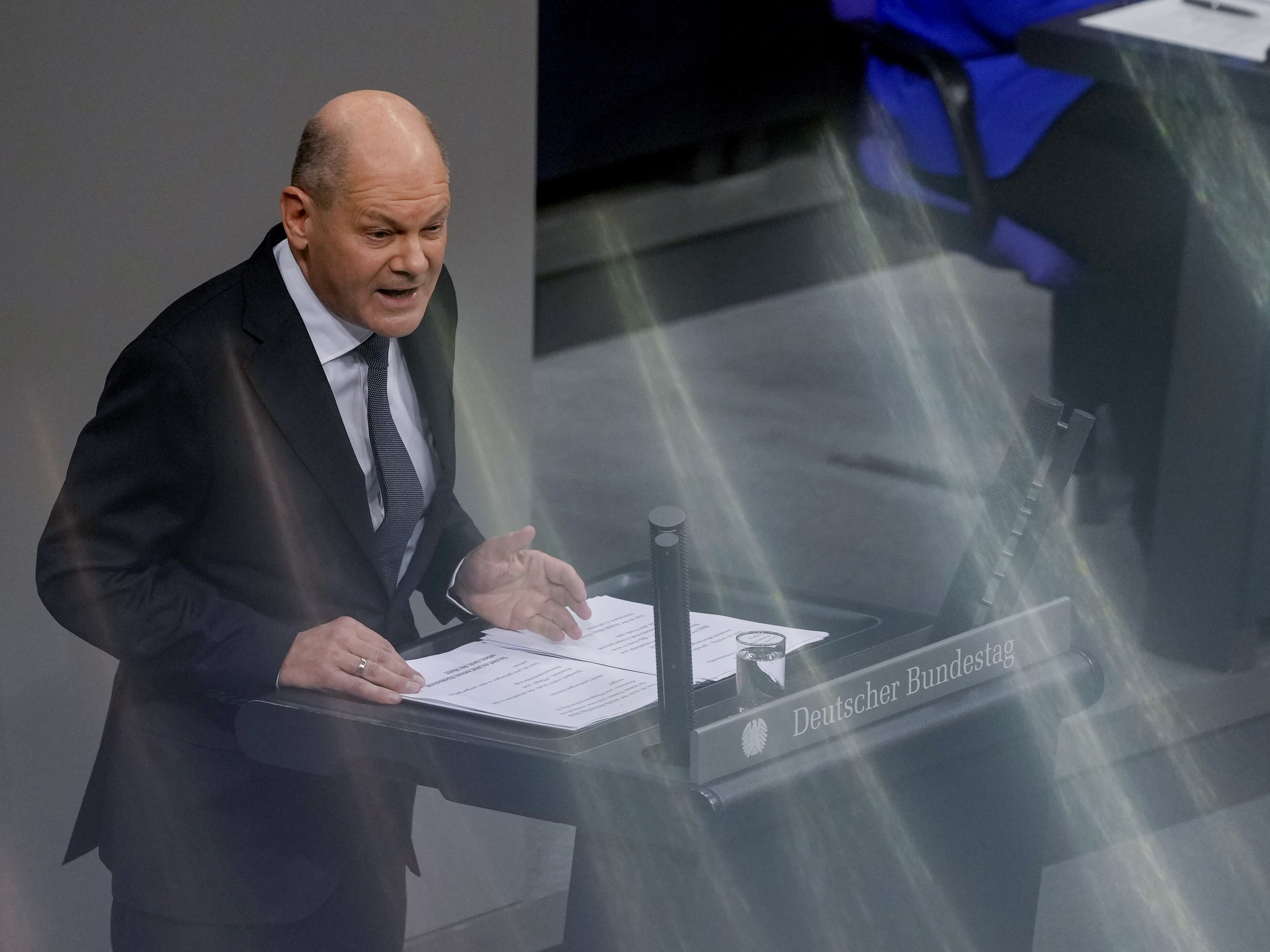 caption: German Chancellor Olaf Scholz speaks during a plenary session at the German Bundestag, where he faces a vote of confidence, Berlin, Germany, on Monday.