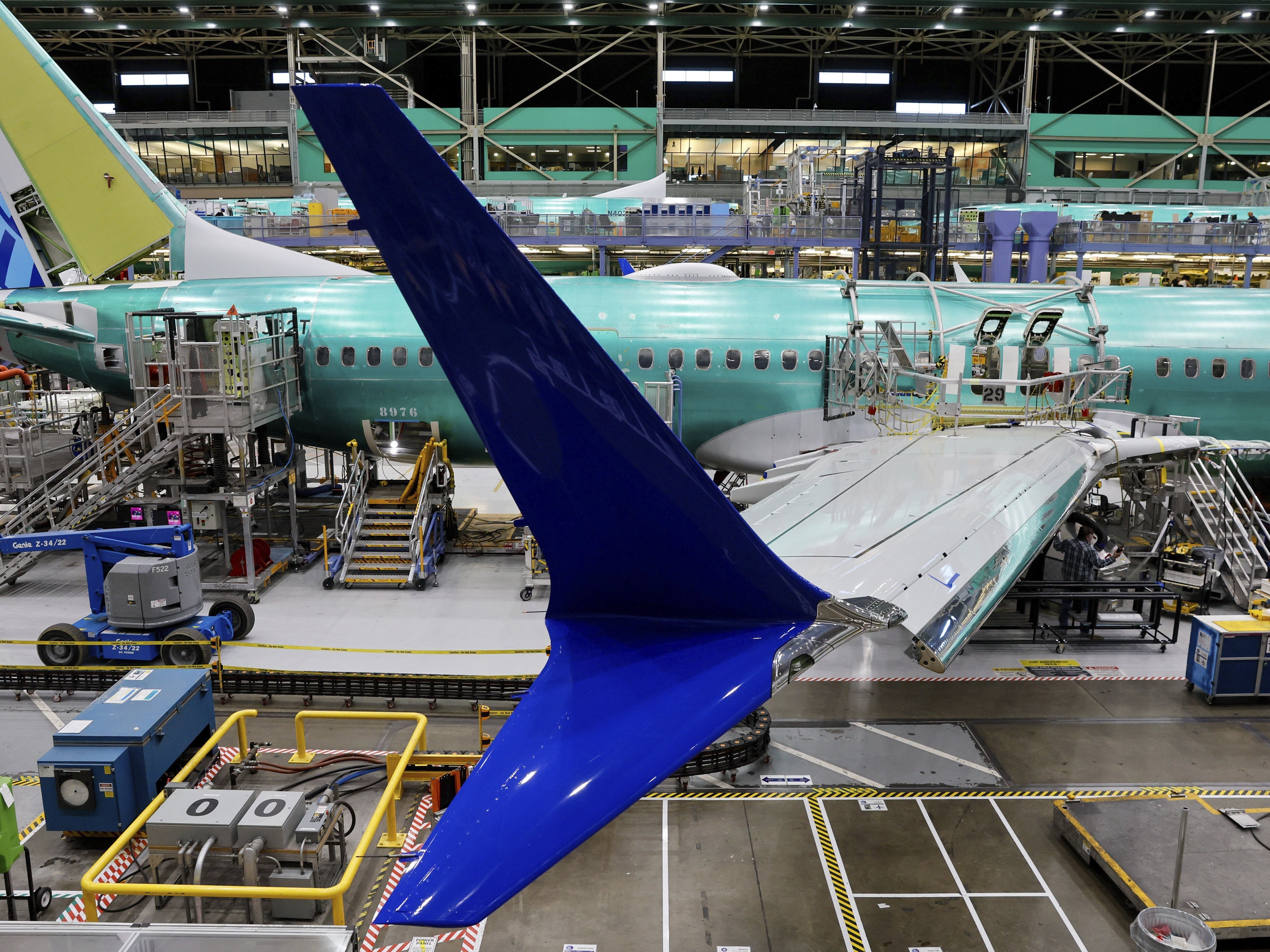 caption: Boeing 737 MAX airplanes sit on the assembly line at the company's facility in Renton, Wash. 