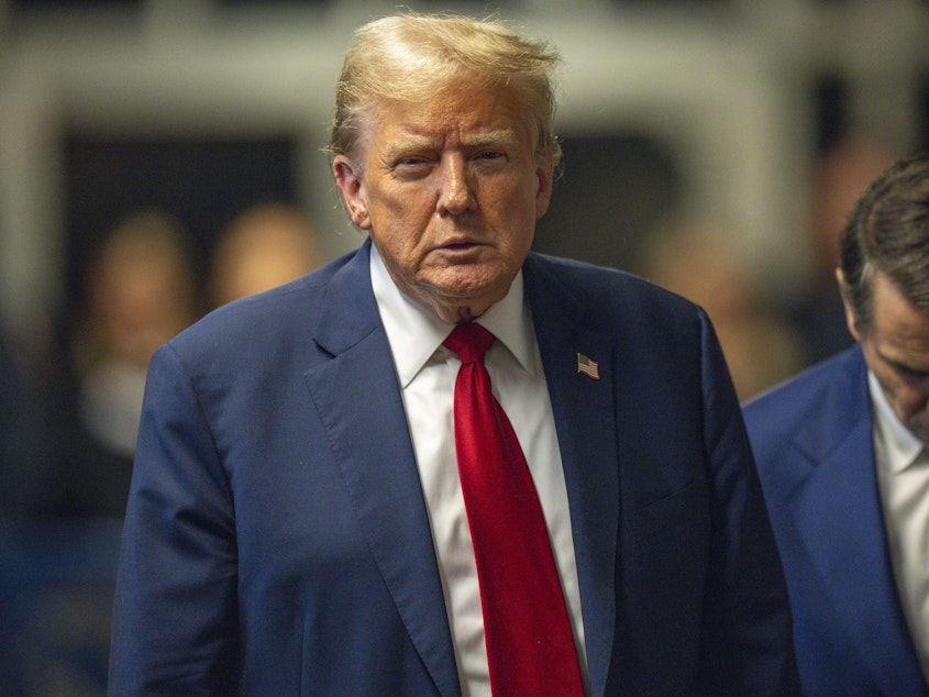 caption: Former President Donald Trump speaks to the media after the day's proceedings in his criminal trial at Manhattan Criminal Court on Thursday in New York City.