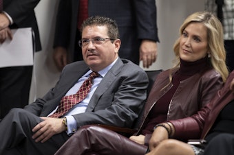caption: The owner of the NFL's Washington team, Dan Snyder, seen with his wife, Tanya Snyder, last year. The team has been fined $10 million by the league for adverse workplace conditions.