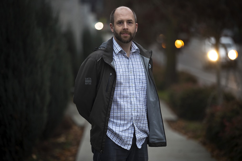 caption: James Baker stands for a portrait on Wednesday, December 4, 2019, on North 34th Street in Seattle.