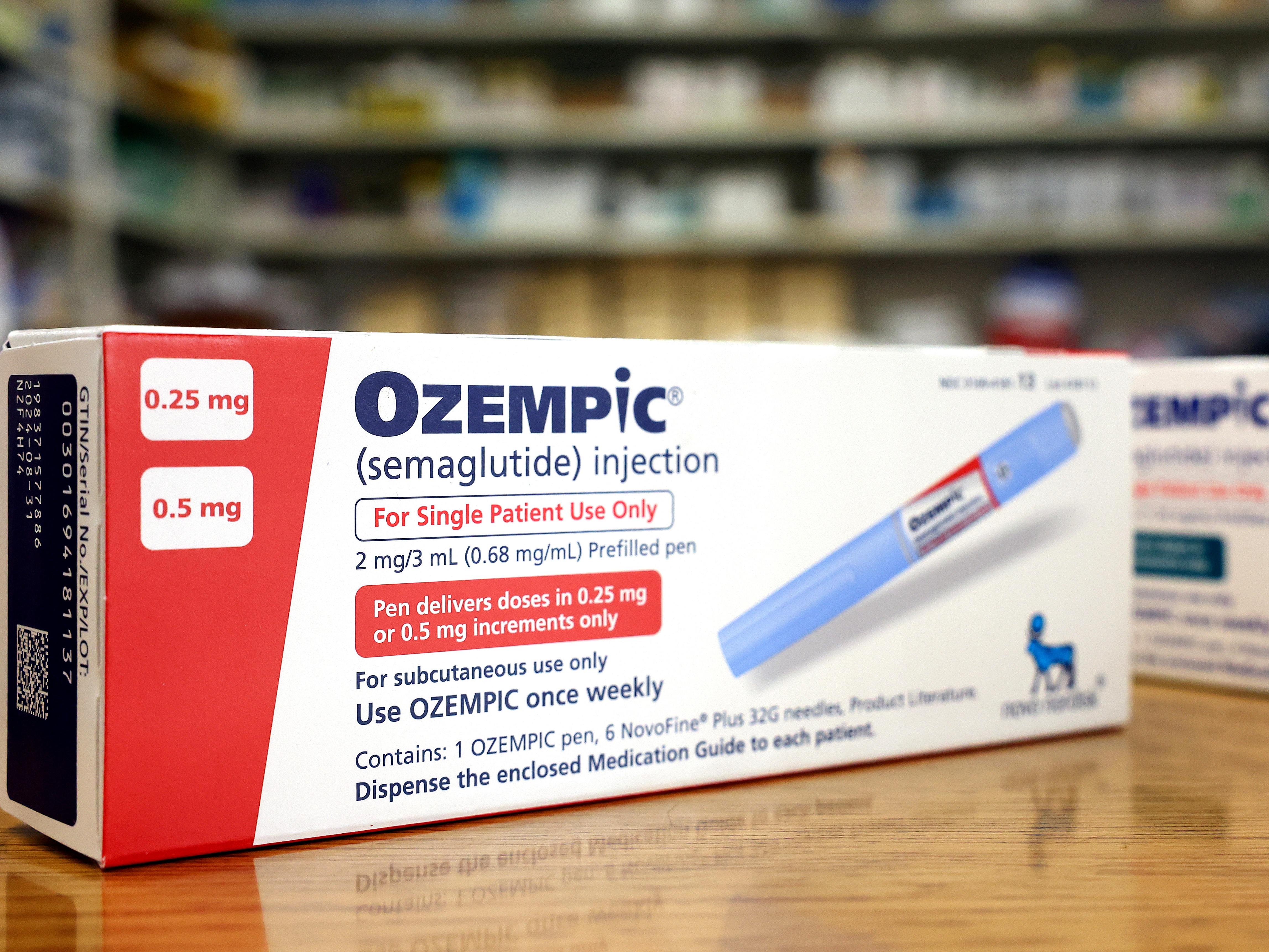 caption: In this photo illustration, boxes of the diabetes drug Ozempic rest on a pharmacy counter on April 17, 2023, in Los Angeles. Ozempic was originally approved by the Food and Drug Administration to treat people with Type 2 diabetes, and it's now also used by many people to lose weight.