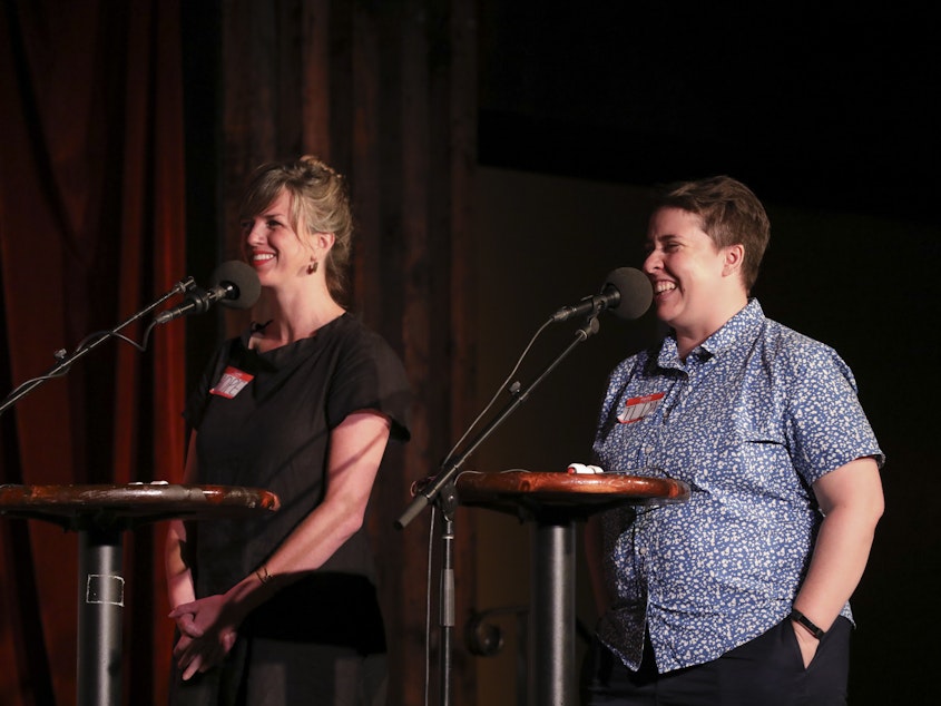 caption: Contestants Hope Dickens and Iliya Smithka appear on <em>Ask Me Another</em> at the Bell House in Brooklyn, New York.