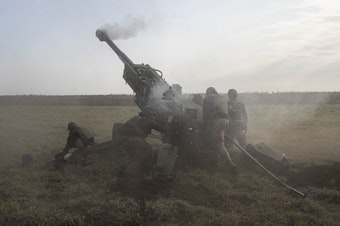caption: The Ukrainian  artillery battery of the 59th Mechanized Brigade fires a howitzer at points controlled by Russian troops in Kherson Oblast, Ukraine on Saturday.