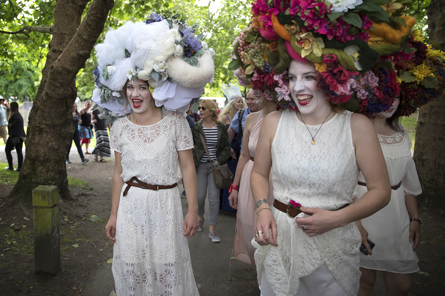 caption: Charlotte Guard, left, and Anna MacCamy, right, laugh while wearing headpieces designed by artist Sofia Babaeva, during the Fremont Solstice Parade and Celebration. Click or tap on the image above for more pictures.