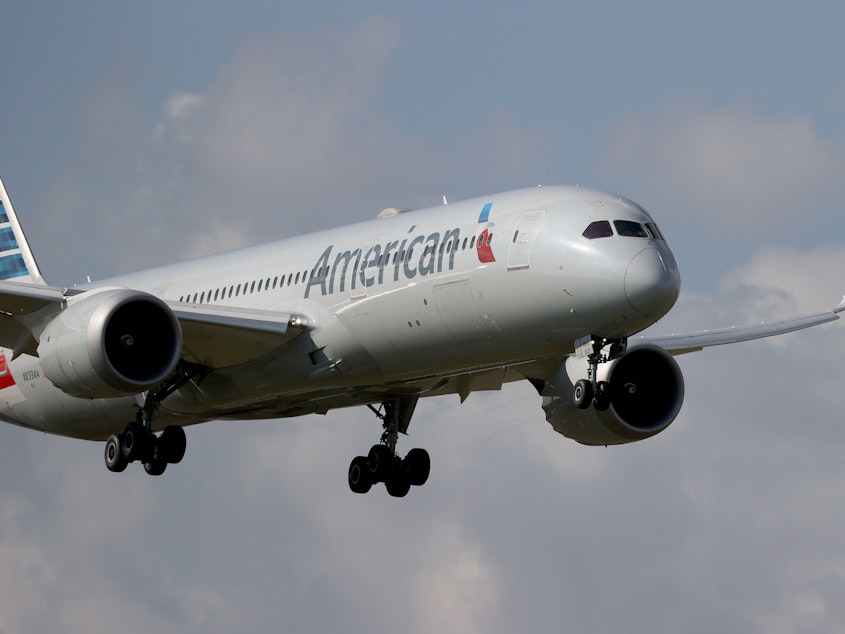 caption: An American Airlines Boeing 787-9 Dreamliner approaches Miami International Airport. In a joint letter, the heads of Boeing and Airbus Americas reportedly called for postponing a planned Jan. 5 rollout of a 5G wireless network.