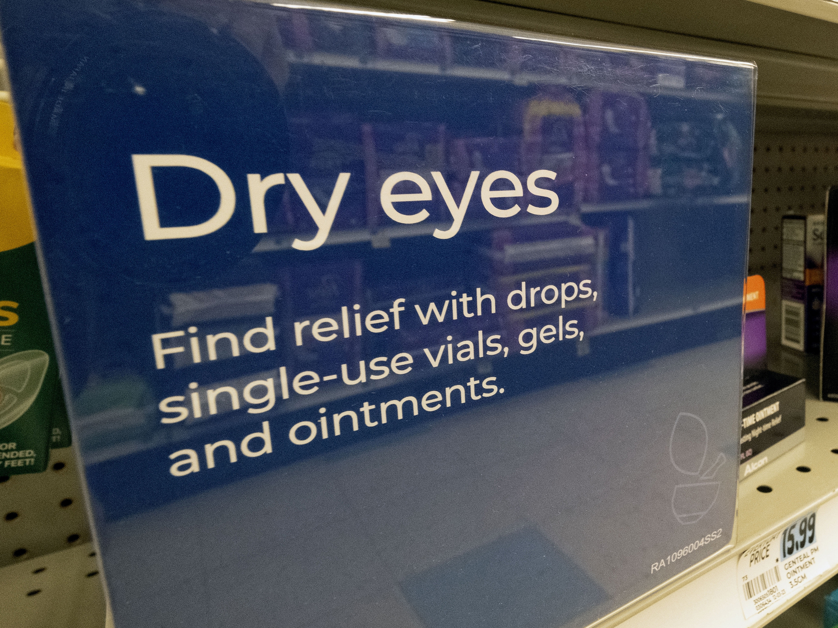 caption: A selection of eye drops line a shelf at a pharmacy in Los Angeles in December 2023.