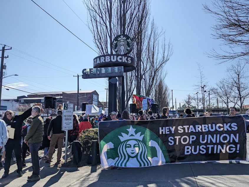 caption: Starbucks employees picket Wednesday, March 22, 2023, outside the company's Seattle headquarters.