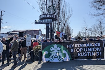 caption: Starbucks employees picket Wednesday, March 22, 2023, outside the company's Seattle headquarters.