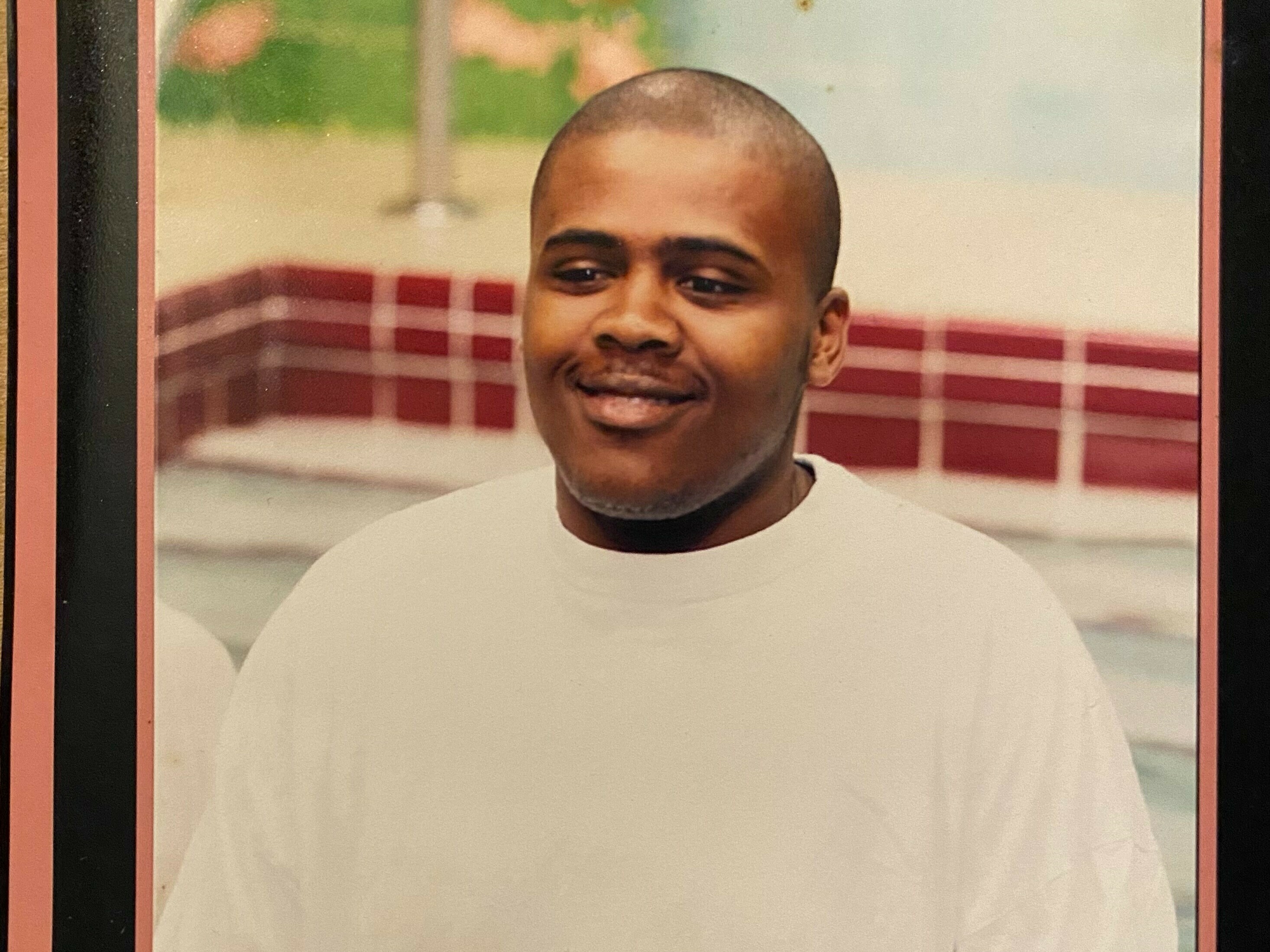 caption: Lashawn Thompson, 35, died in the Fulton County Jail in Atlanta in September 2022. His family's attorney, Michael Harper, said Thompson's body was covered with insect bite marks.