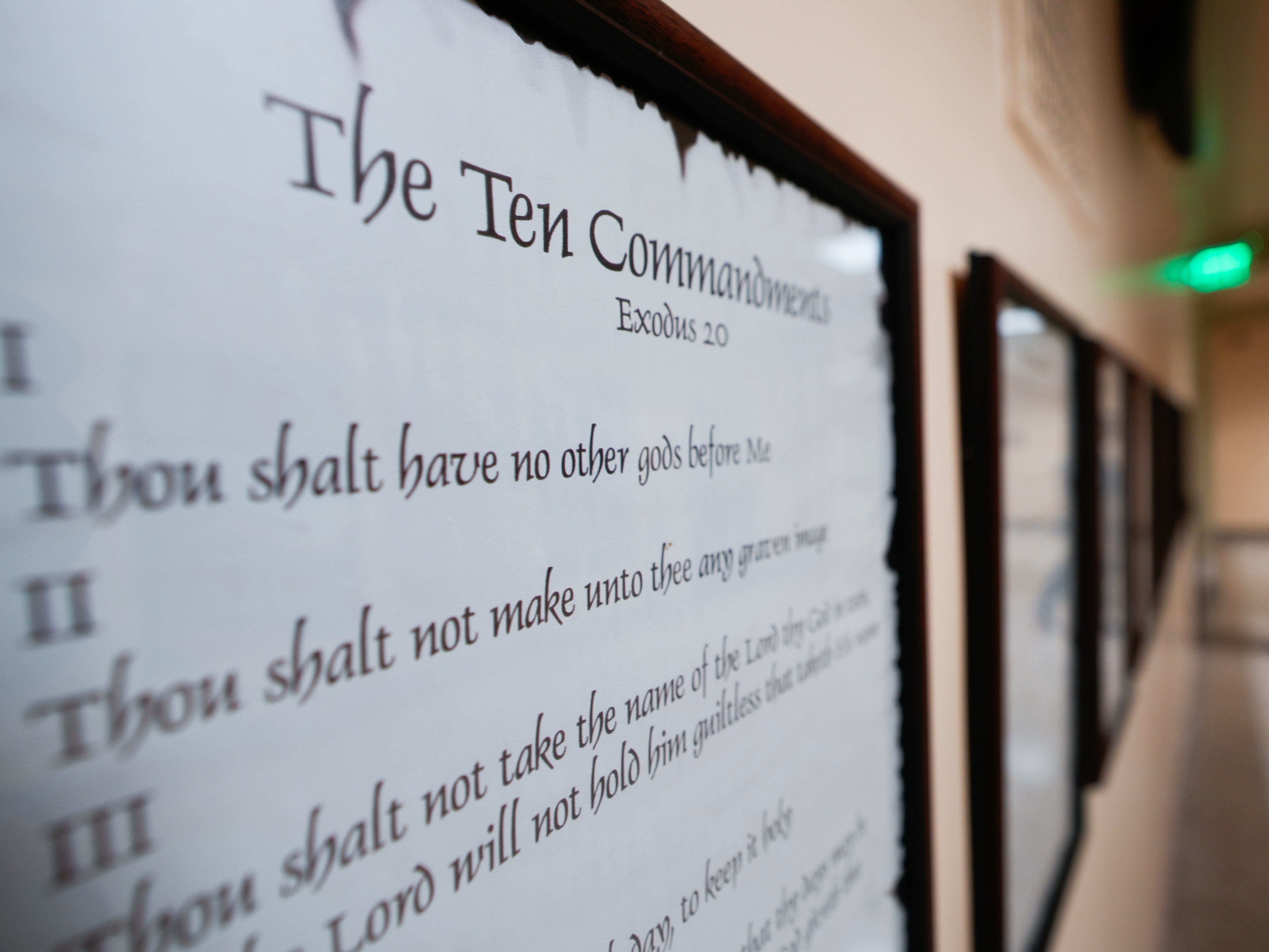 caption: A copy of the Ten Commandments is posted along with other historical documents in a hallway of the Georgia Capitol, June 20, 2024, in Atlanta.