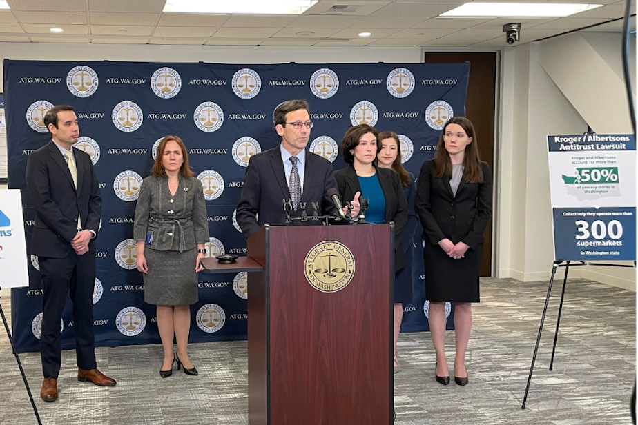 caption: Washington State Attorney General Bob Ferguson announces an antitrust lawsuit challenging the merger between grocery companies Kroger and Albertsons in January 2024.  