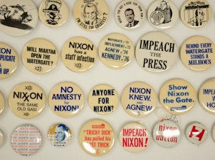 caption: The National Museum of American History has some impeachment buttons from the Nixon years in their collection.