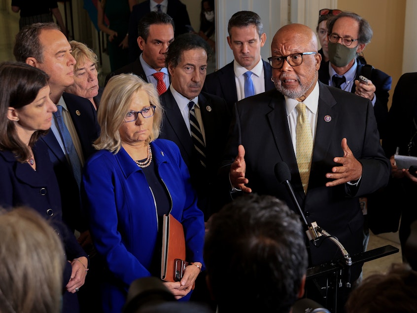 caption: Reps. Bennie Thompson (right) and Liz Cheney, joined by fellow committee members, speak to the media after a July 27 hearing of the House select committee investigating the Jan. 6 attack on the U.S. Capitol.