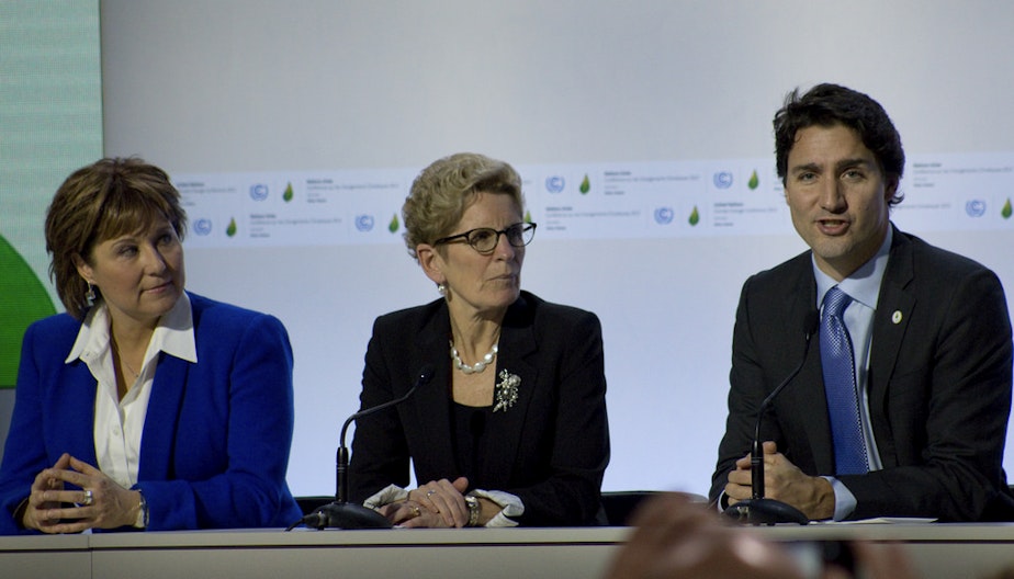 caption: Canada Prime Minister Justin Trudeau, right, speaks at the United Nations COP 21 climate change conference on Nov. 30, 2015. 