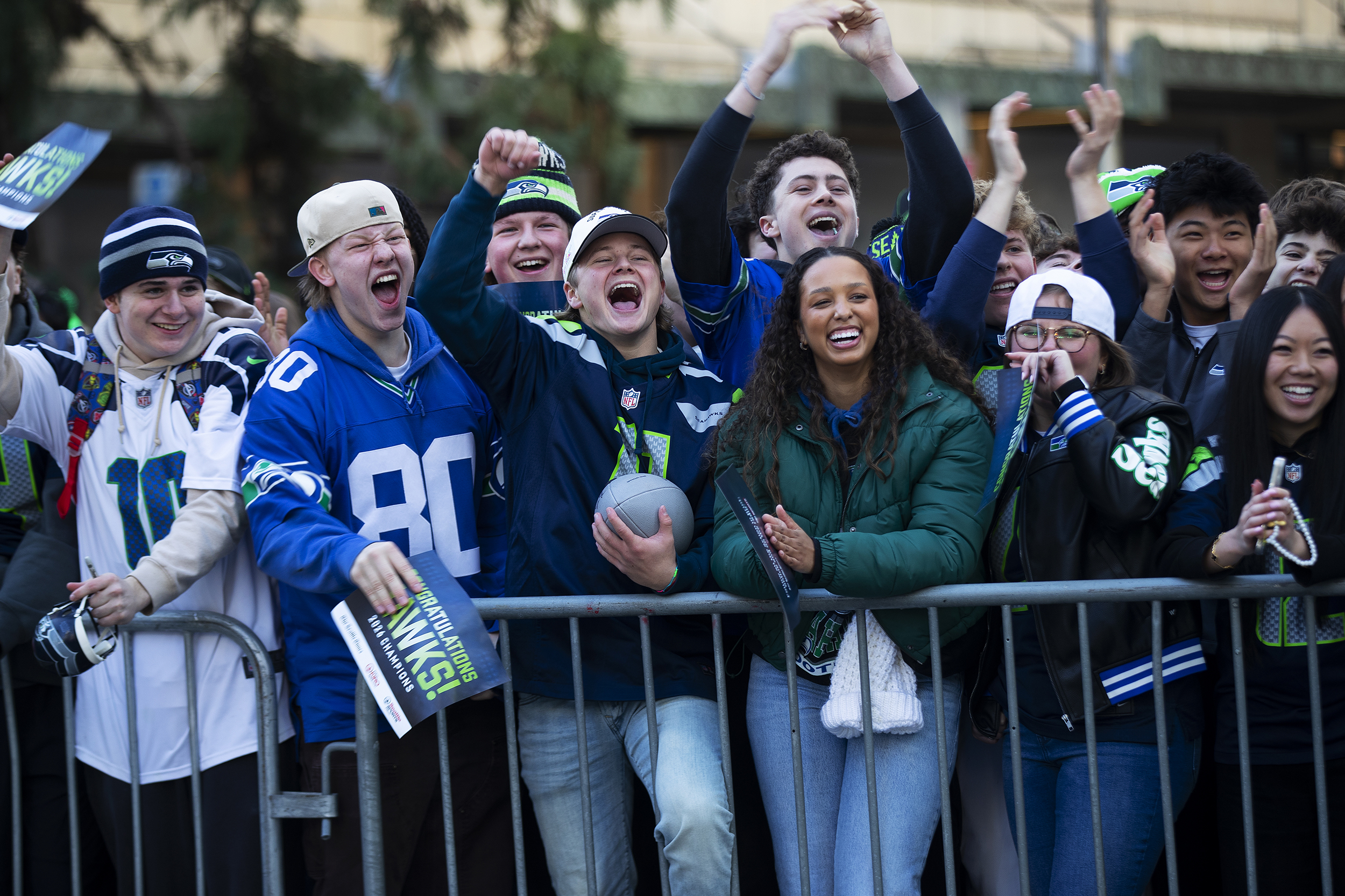 caption: Seahawks fans cheer while waiting for the start of the Seahawks parade on Wednesday, February 11, 2026, along 4th Avenue in Seattle.  