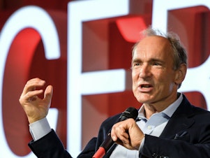 caption: British computer scientist Tim Berners-Lee is selling the source code for the World Wide Web as an NFT. Here, Berners-Lee delivers a speech during an event at the CERN in Meyrin near Geneva, Switzerland.
