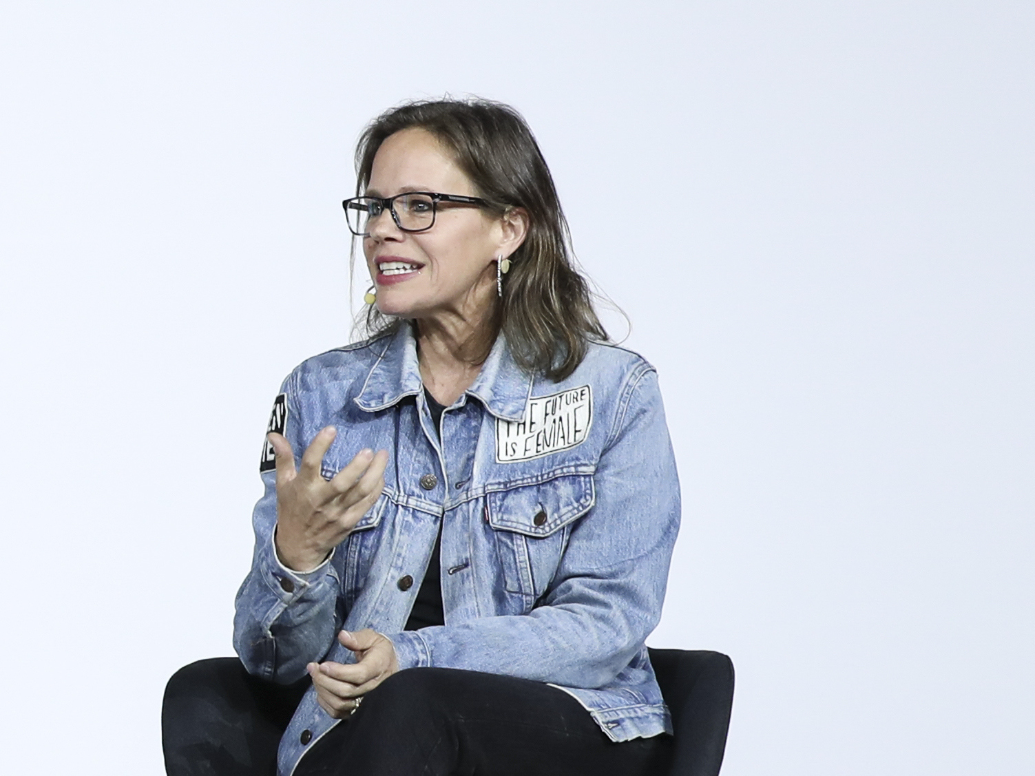 caption: Former Levi's executive Jennifer Sey speaks at a conference in 2018.