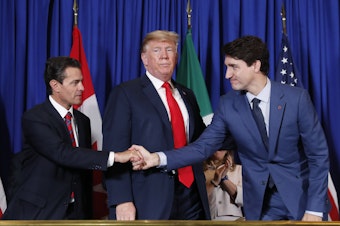 caption: From left, then-Mexican President Enrique Peña Nieto, President Trump and Canadian Prime Minister Justin Trudeau participate in a USMCA signing ceremony in November 2018 in Buenos Aires, Argentina.