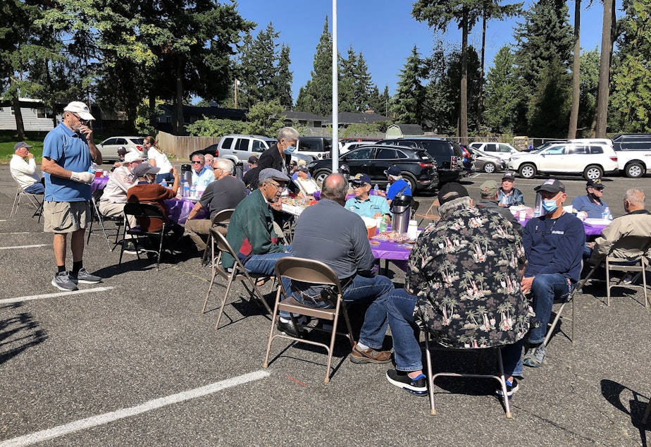 caption: For Covid safety, Heroes' Cafe lunch meetings have been held outdoors, in the parking lot of New Life Church in Lynnwood, WA. 