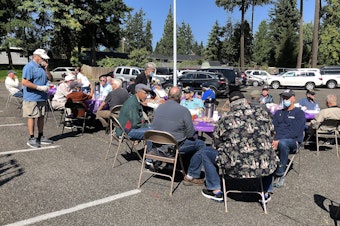 caption: For Covid safety, Heroes' Cafe lunch meetings have been held outdoors, in the parking lot of New Life Church in Lynnwood, WA. 