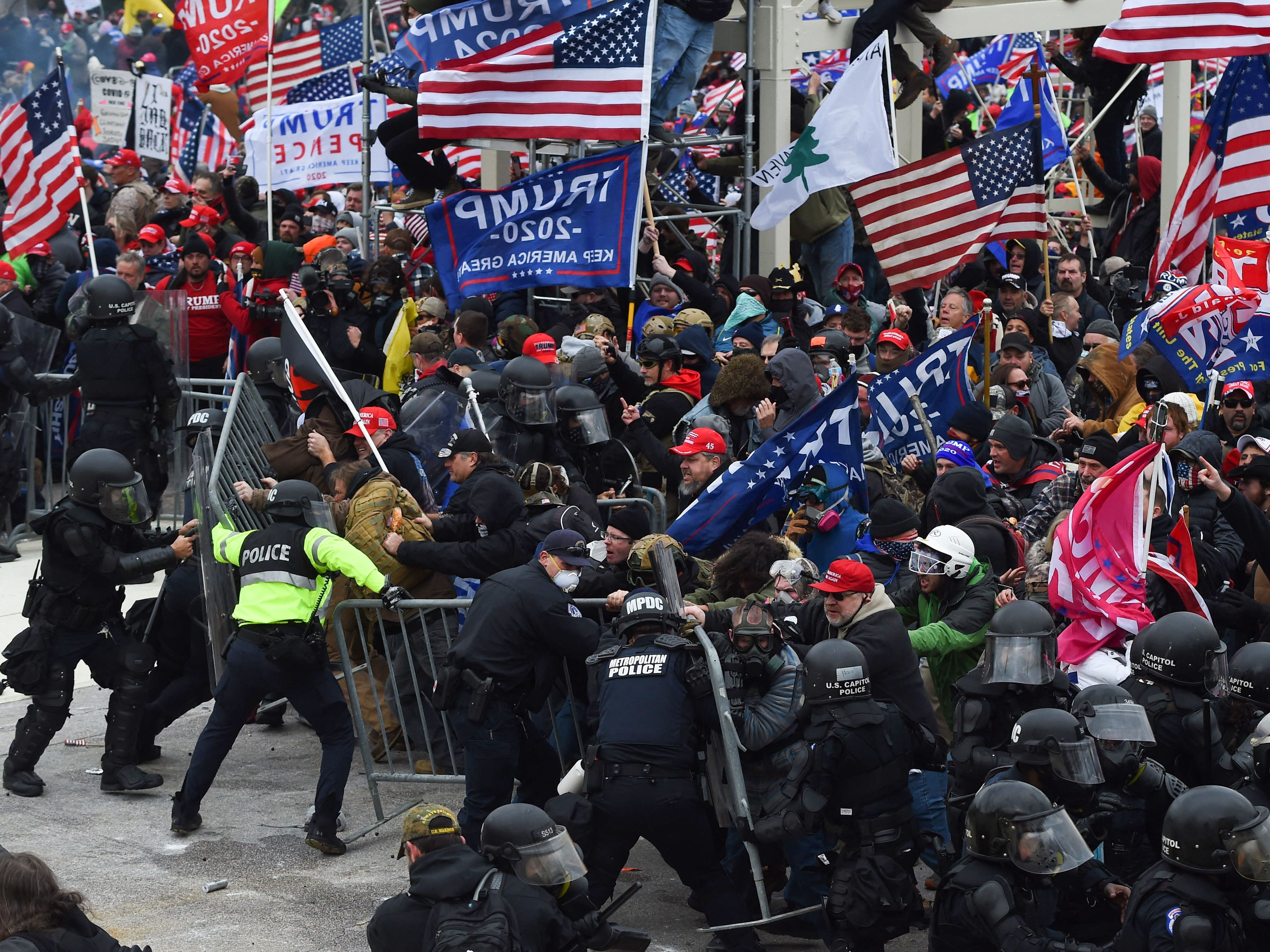 caption: Supporters of President Trump clash with police and security forces as they push barricades to storm the U.S. Capitol in Washington, D.C on January 6, 2021.