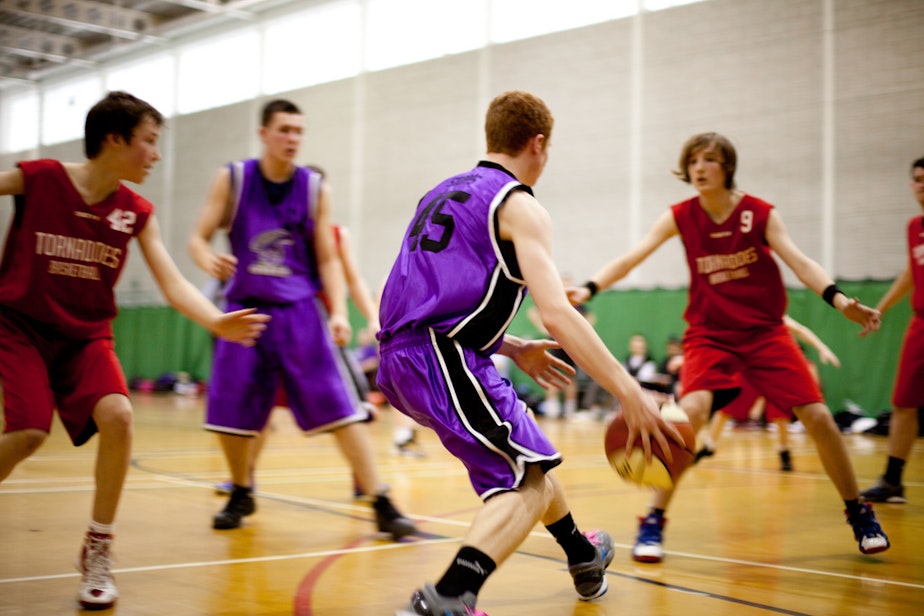 caption: File photo of students playing basketball.