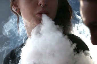 caption: Scientists are still learning new things about the possible health impacts of vaping as the FDA struggles to regulate the booming industry, which could be worth more than $40 billion by 2025. (Justin Sullivan/Getty Images)