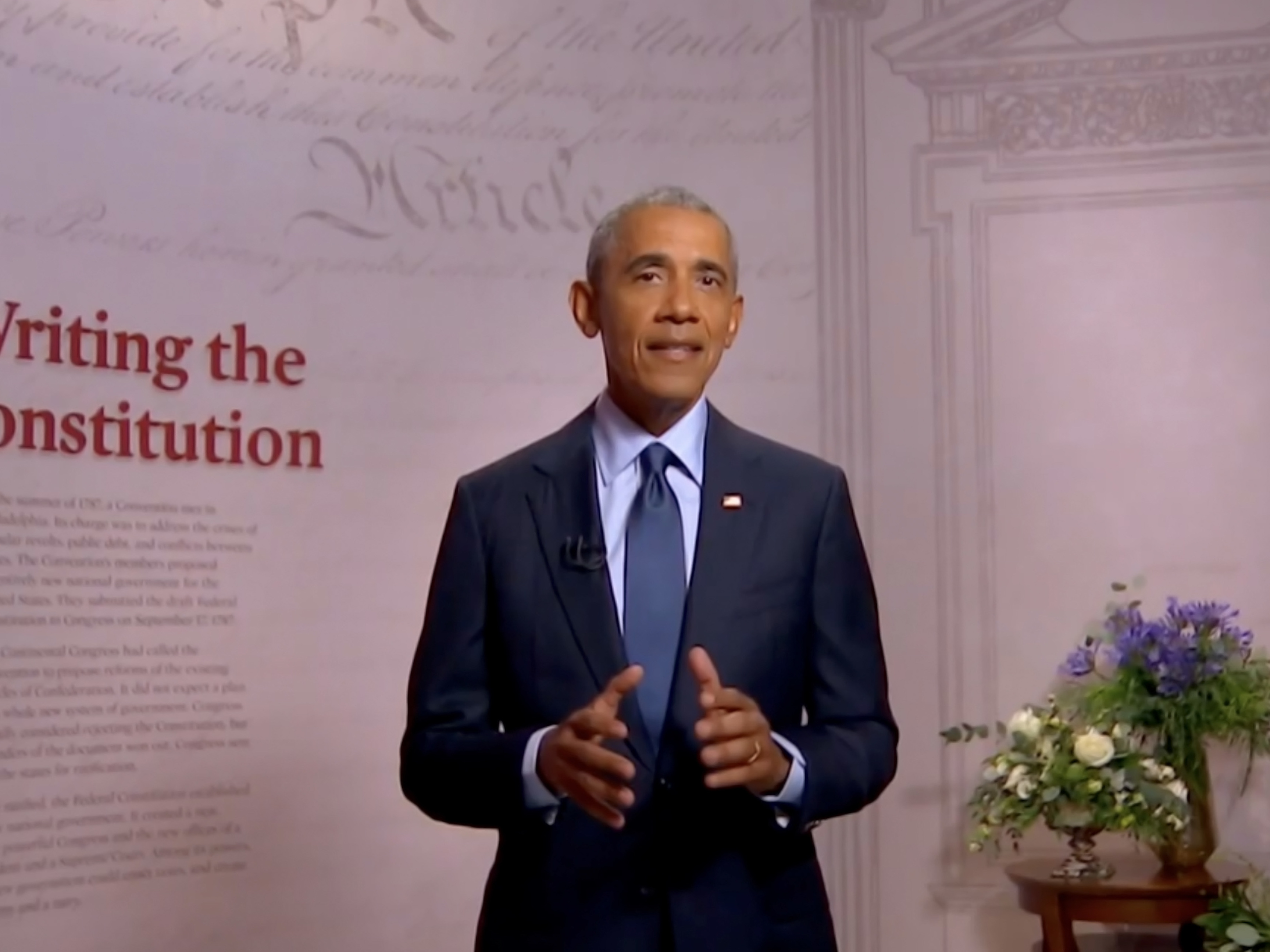 caption: Former President Barack Obama addresses the virtual convention on Wednesday.