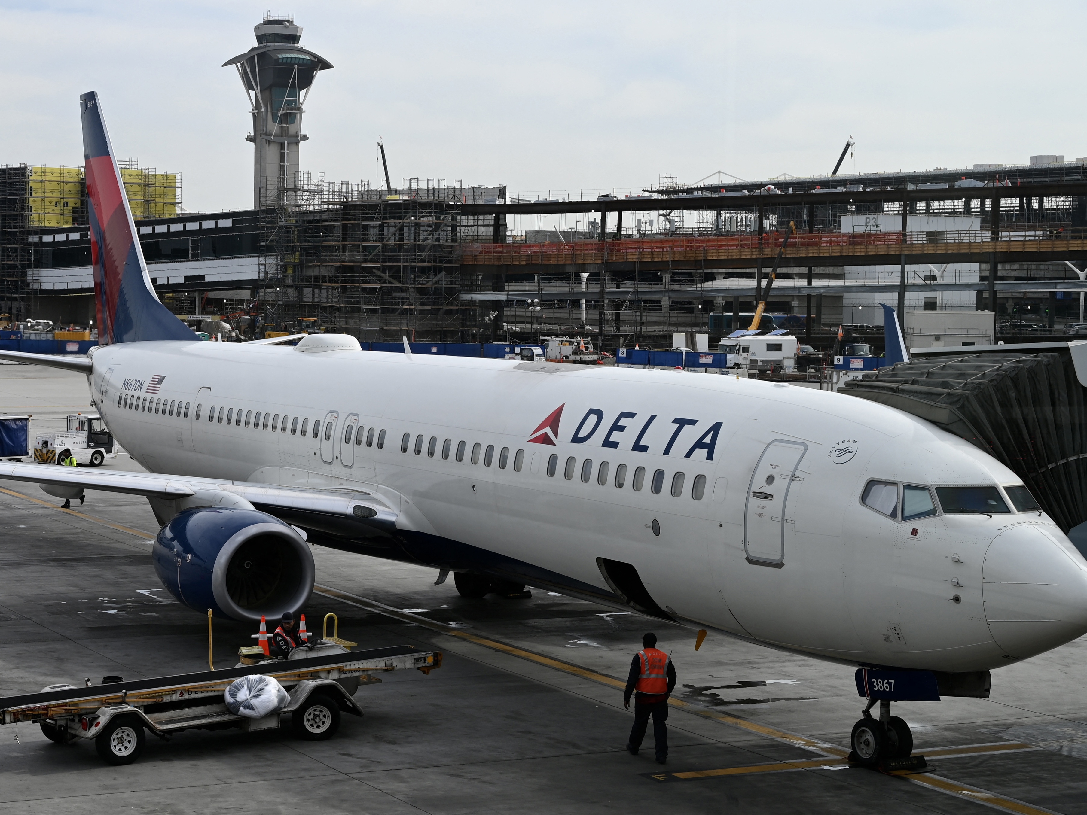 caption: A Delta Air Lines plane is seen at Los Angeles International Airport on Jan. 11, 2023. Earlier this week, a cabin pressurization issue aboard a Delta flight caused a number of passengers to bleed from the nose and ears.