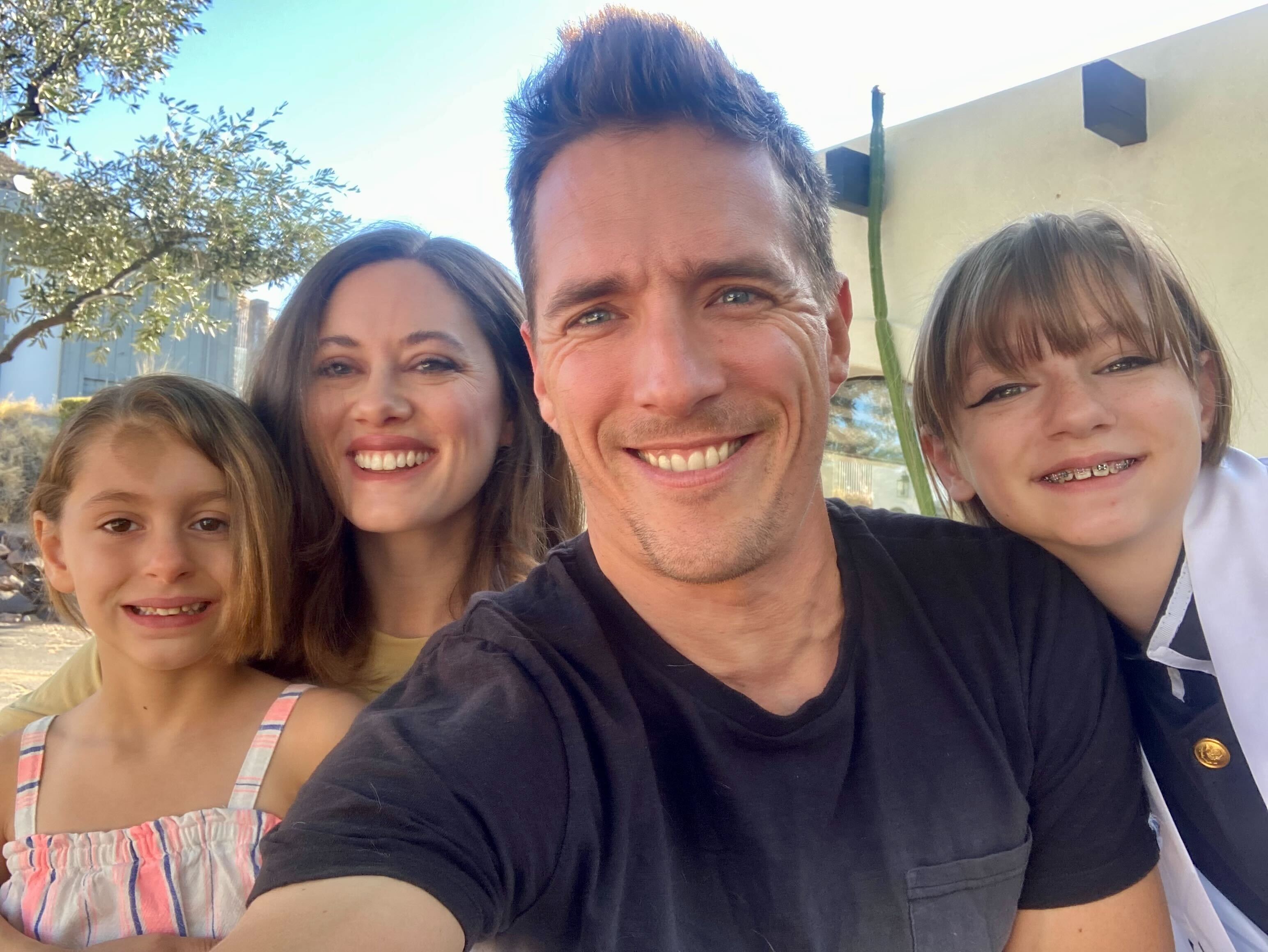 caption: Here & Now's Peter O'Dowd with his family on his daughters' last days of 7th grade and kindergarten. (Peter O'Dowd/ Here & Now)