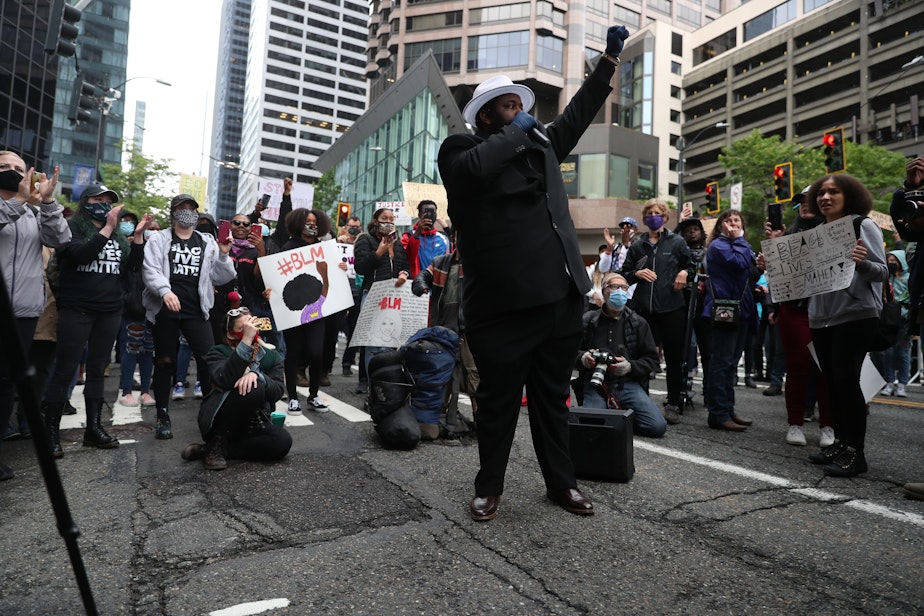 caption: Protesters gather at 5th Avenue and Cherry Street in downtown Seattle on Saturday, May 30, 2020. They were protesting the death in Minneapolis of an African American man, George Floyd, in police custody.