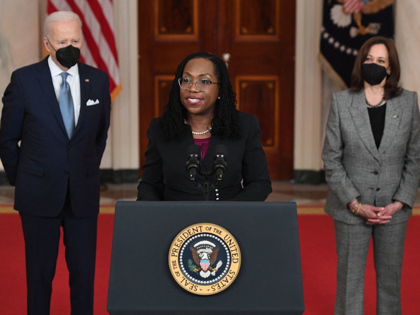 caption: Judge Ketanji Brown Jackson, with President Joe Biden and Vice President Kamala Harris, speaks after being nominated for the U.S. Supreme Court at the White House in Washington, D.C., on February 25, 2022.