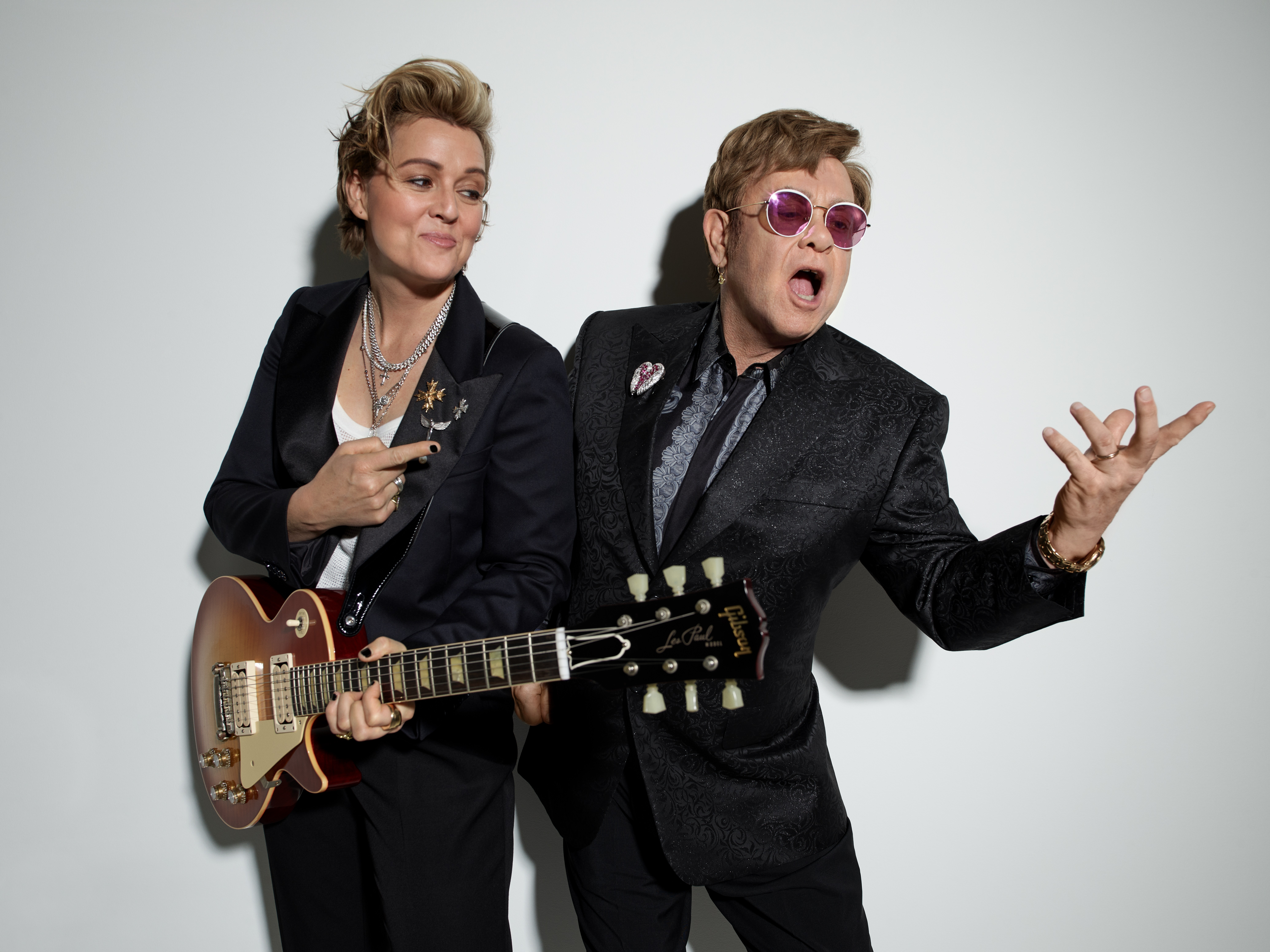 caption: Singer/songwriters Brandi Carlile and Elton John