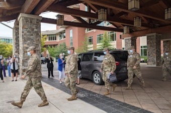 caption: National Guard deploys at Peacehealth Sacred Heart Medical Center at Riverbend in Springfield on August 30. 