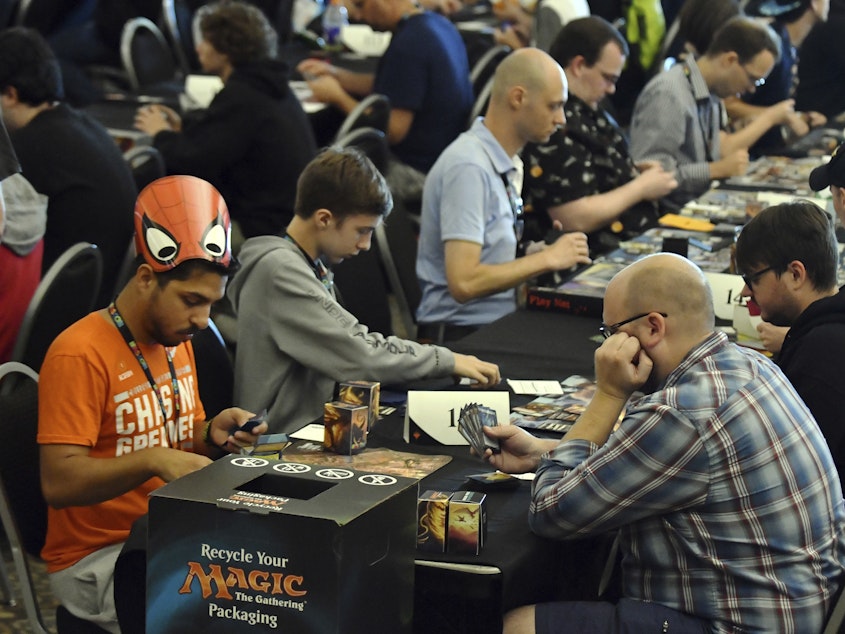 caption: Players compete in a <em>Magic: The Gathering</em> tournament at Hasbro's HASCON in 2017.
