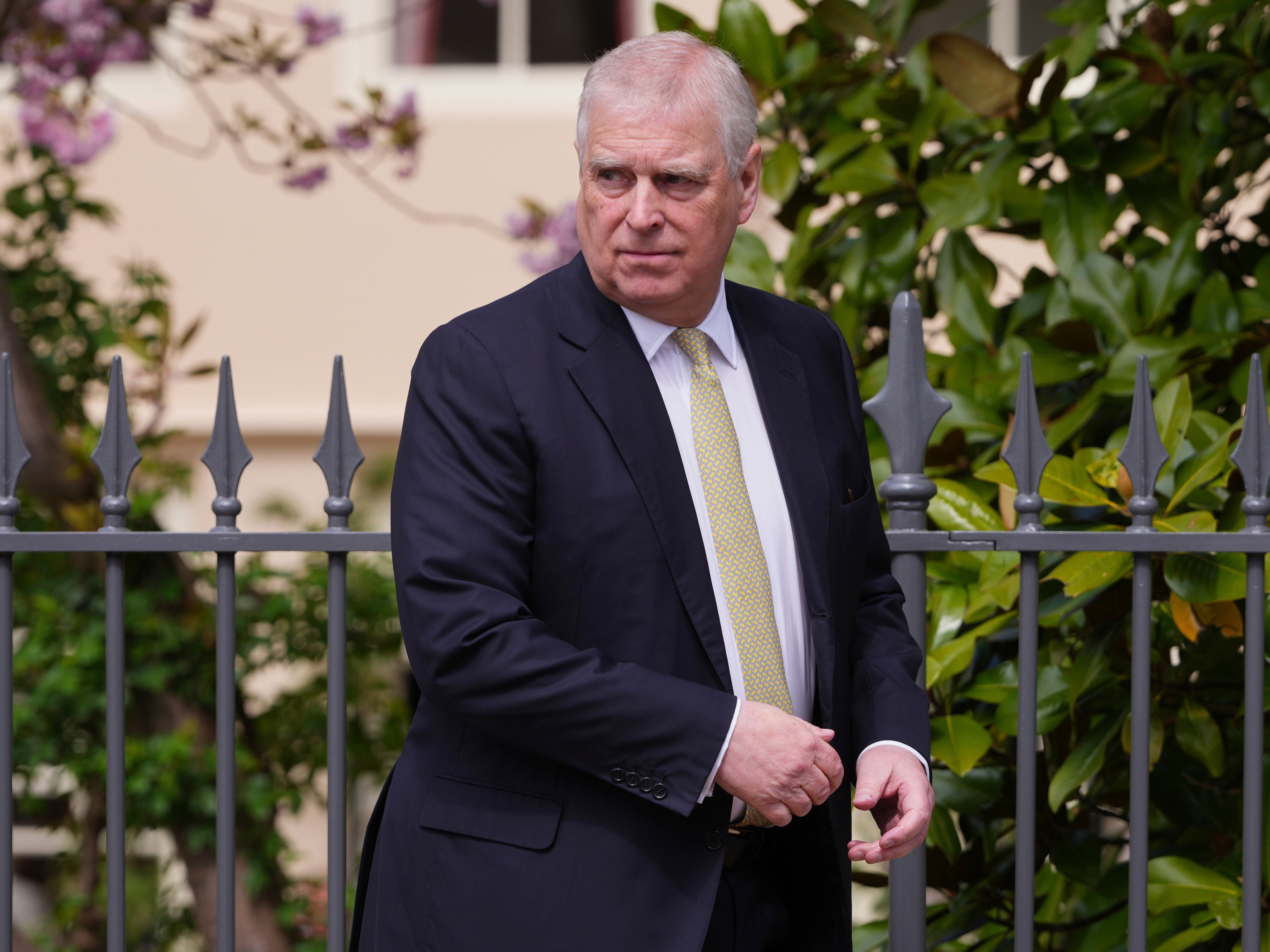 caption: Prince Andrew leaves attending the Easter Matins Service at St. George's Chapel, Windsor Castle, England, April 20.