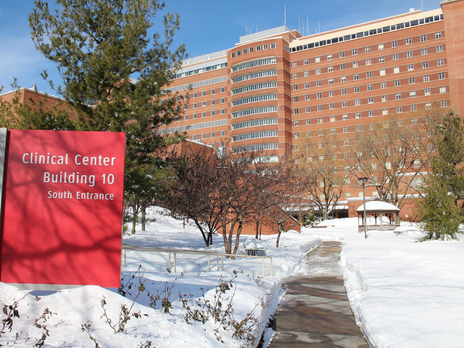 caption: Clinical research conducted at the National Institutes of Health campus in Bethesda, Md., continues but recruitment of new patients is on hold.