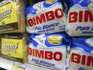 caption: Bimbo bread is displayed on a shelf at a market in Anaheim, Calif., in 2003. On Tuesday, U.S. federal food safety regulators warned Bimbo Bakeries USA - which includes brands such as Sara Lee, Oroweat, Thomas', Entenmann's and Ball Park buns and rolls - to stop using labels that say its products contain potentially dangerous allergens when they don't.