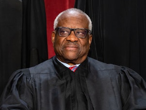 caption: Associate Justice Clarence Thomas during the formal group photograph at the Supreme Court in Washington, D.C., on Oct. 7, 2022.