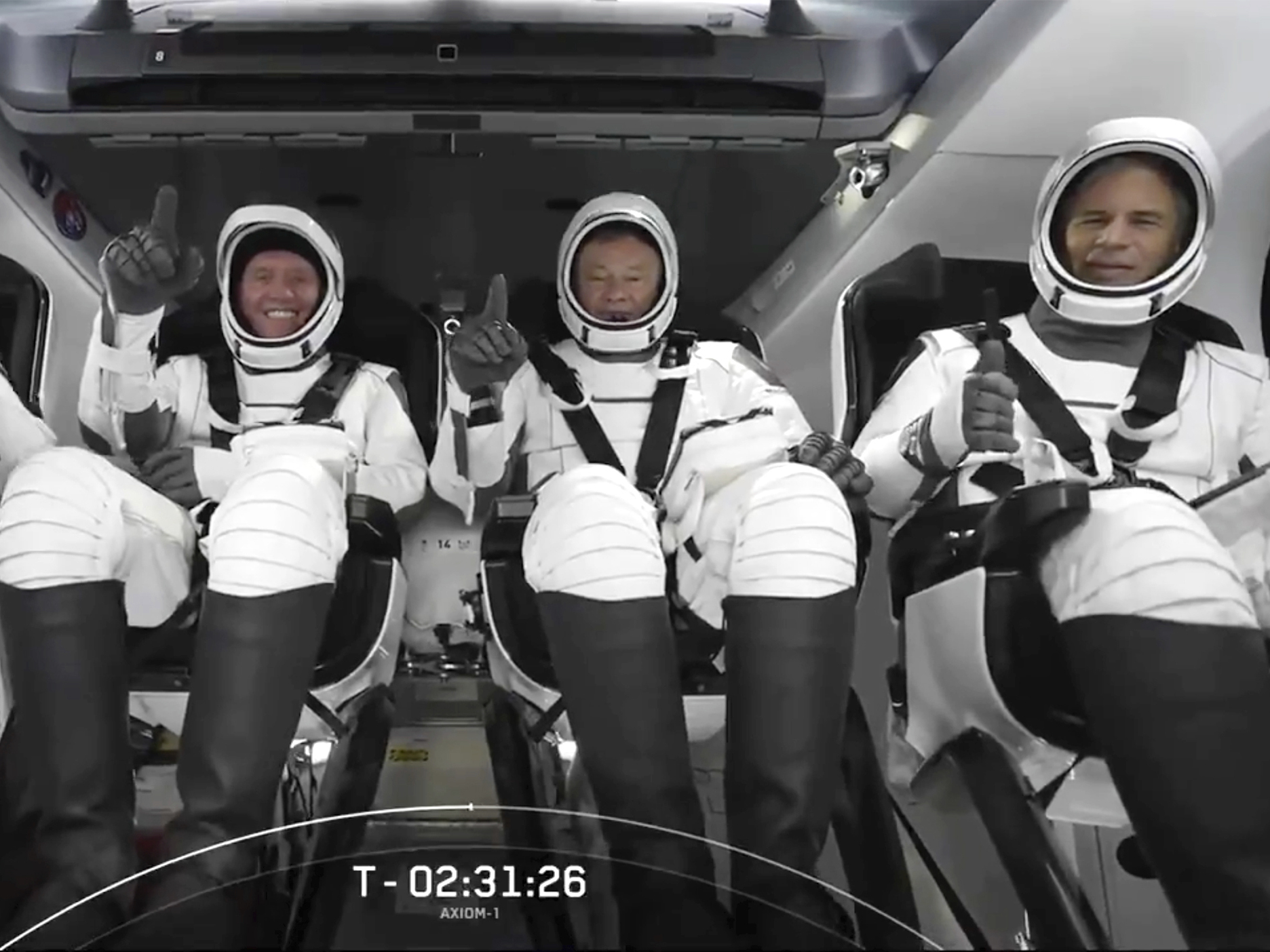 caption: The SpaceX crew seated in the Dragon spacecraft earlier this month in Cape Canaveral, Fla.