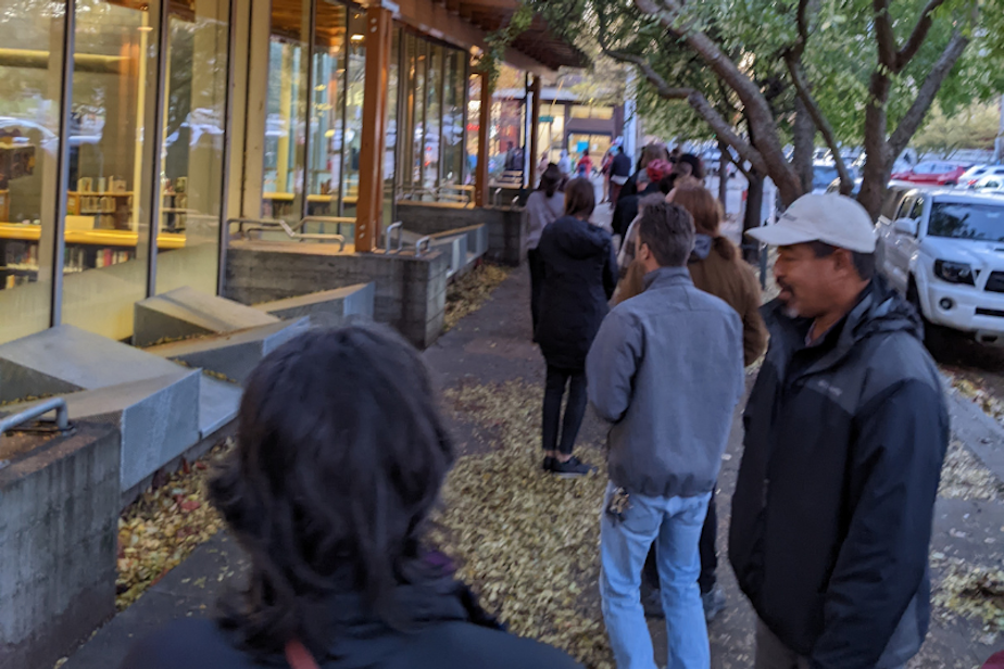 caption: Lines of voters stretch out the door at a voting center in Ballard on Election Day, Nov. 8, 2022.
