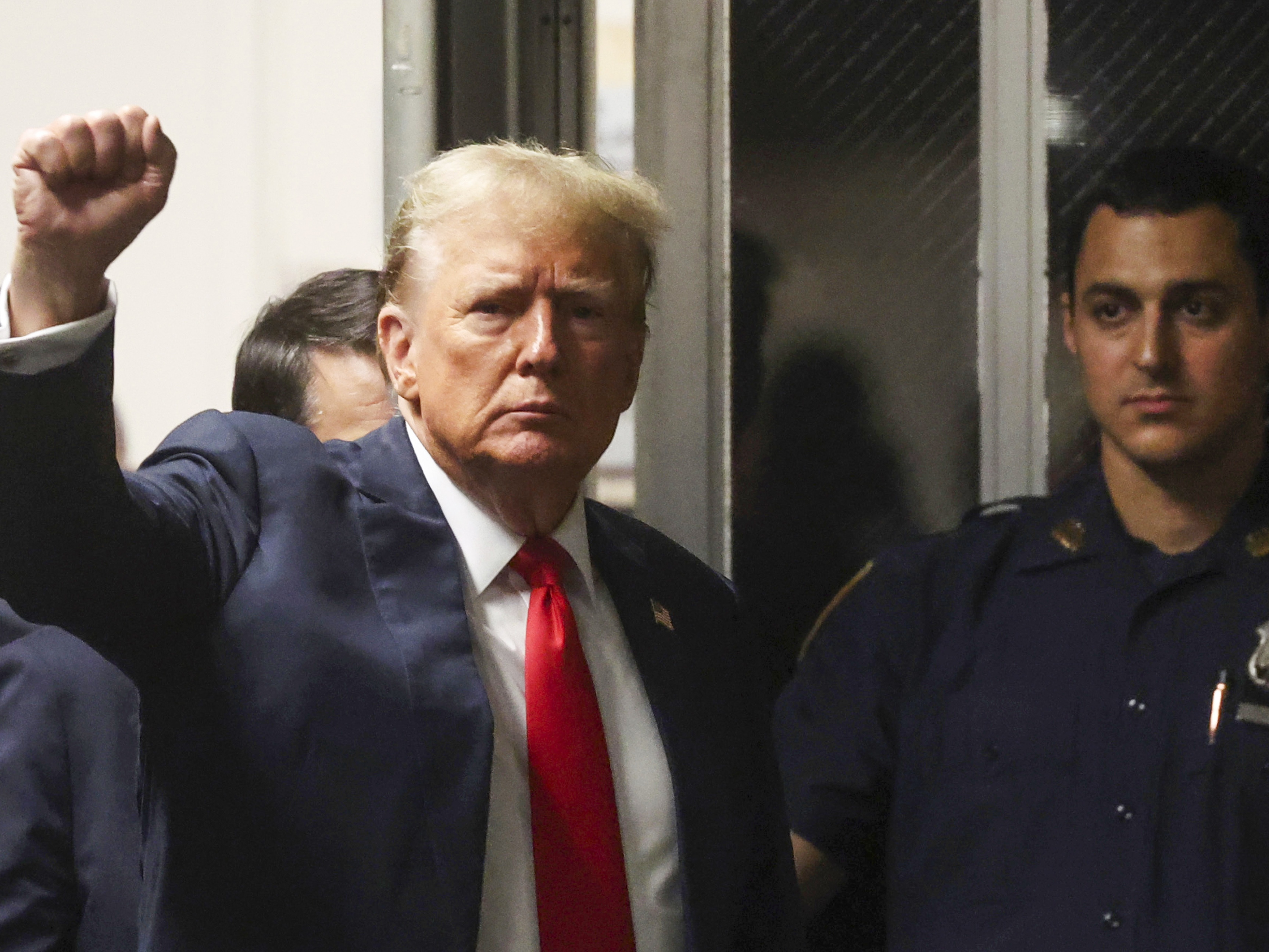 caption: President Trump, shown at Manhattan criminal court in New York, May 28, 2024, before he was re-elected, reacts as he walks back into the courtroom after a break during closing arguments in his hush money trial.