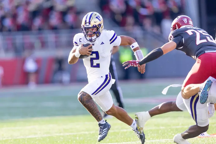 caption: University of Washington Huskies quarterback Demond Williams Jr. plays against Washington State University in the Apple Cup on September 20, 2025.