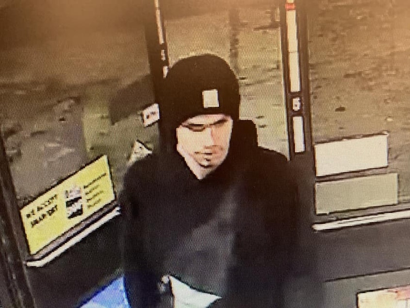 caption: This surveillance video image released by the Yakima Police Department shows a suspect sought in a shooting at a convenience store in Yakima, Wash., early on Tuesday.